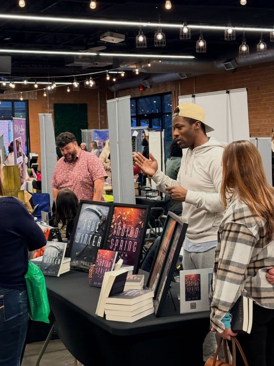Book signing event with an author at a table